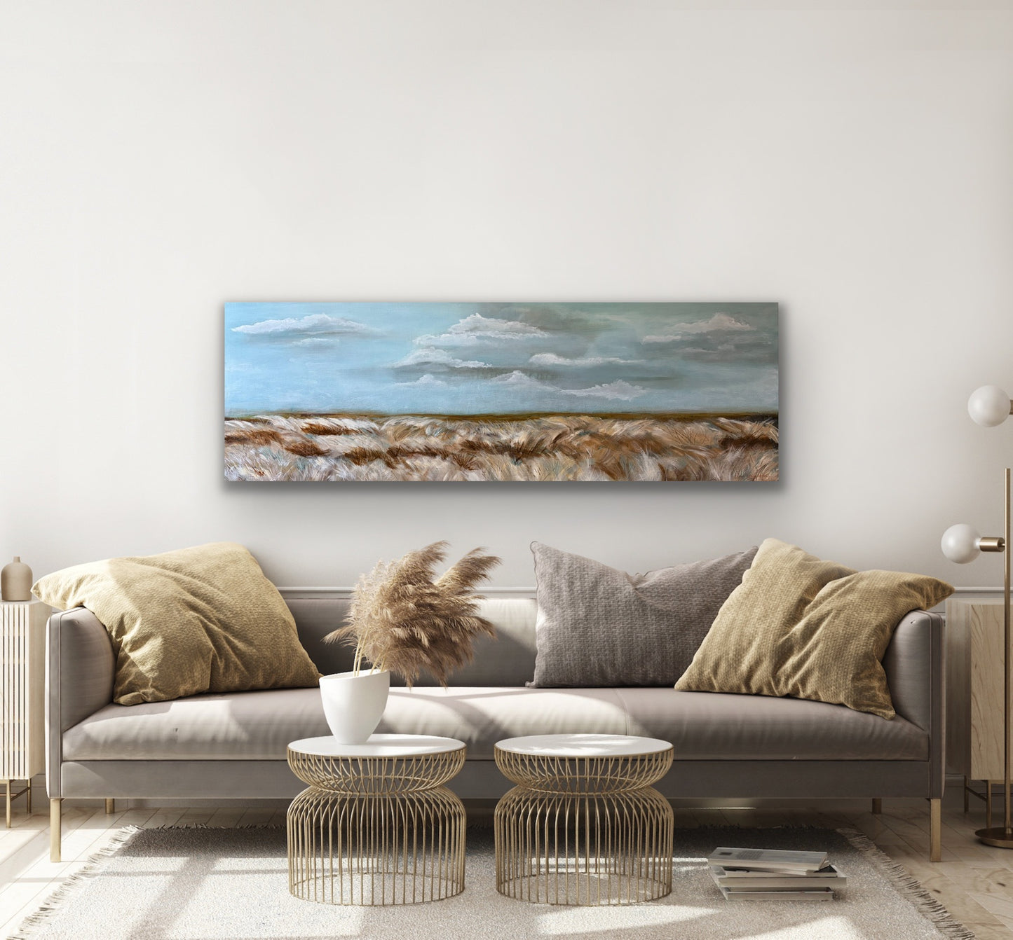 A mixed media painting of  tall grasses blowing the the wind soft clouds and blue sky above by Wendy Peters