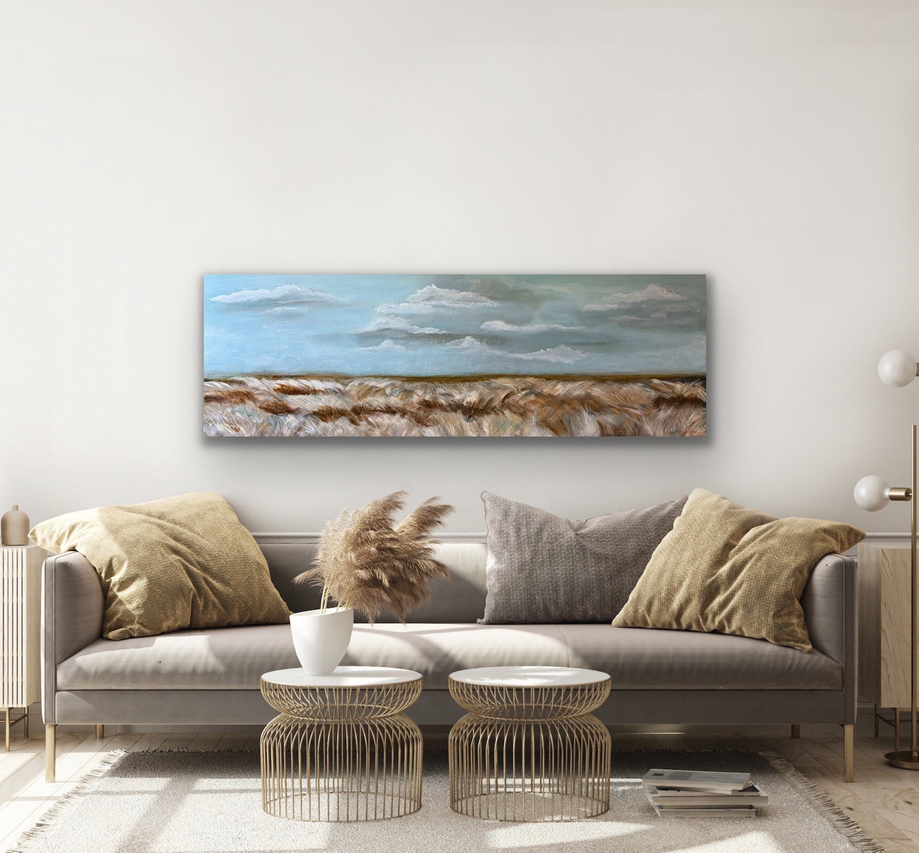 A mixed media painting of  tall grasses blowing the the wind soft clouds and blue sky above by Wendy Peters