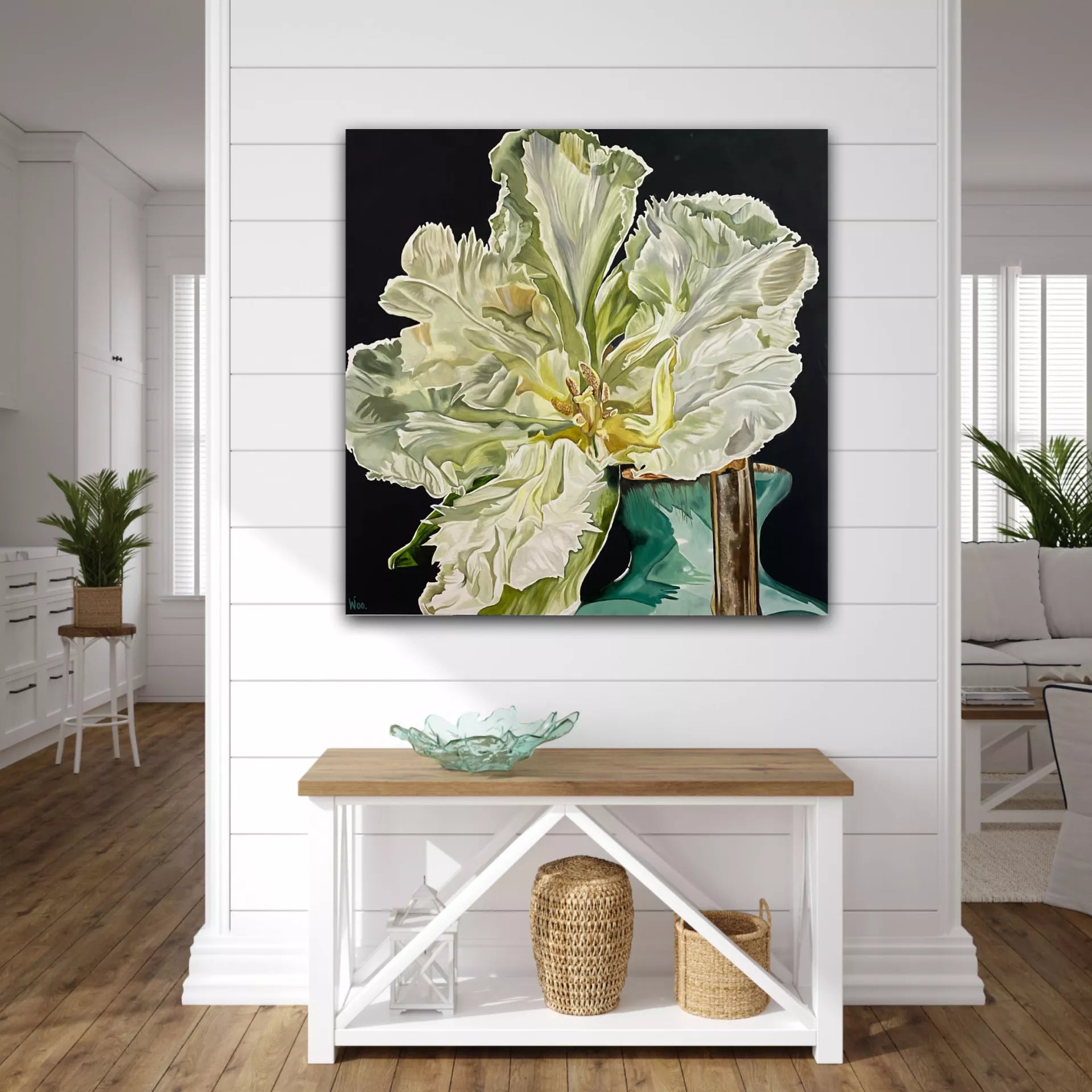 A limited edition print of a floral arrangement featuring a white and green flower with a black background.