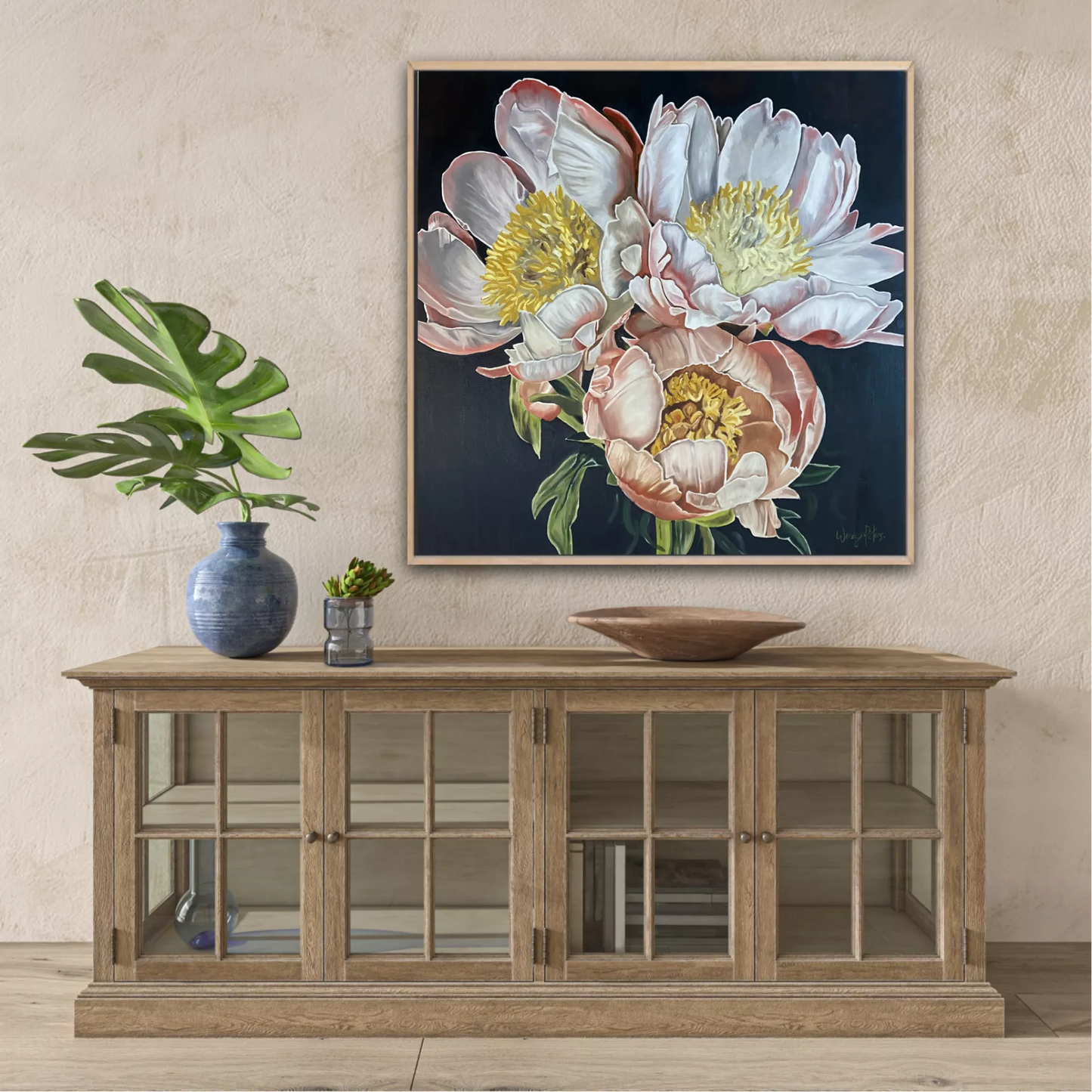 A limited edition print of a 3 peonies on a dark background featuring detailed, colours of pink, white and yellow by Wendy Peters
