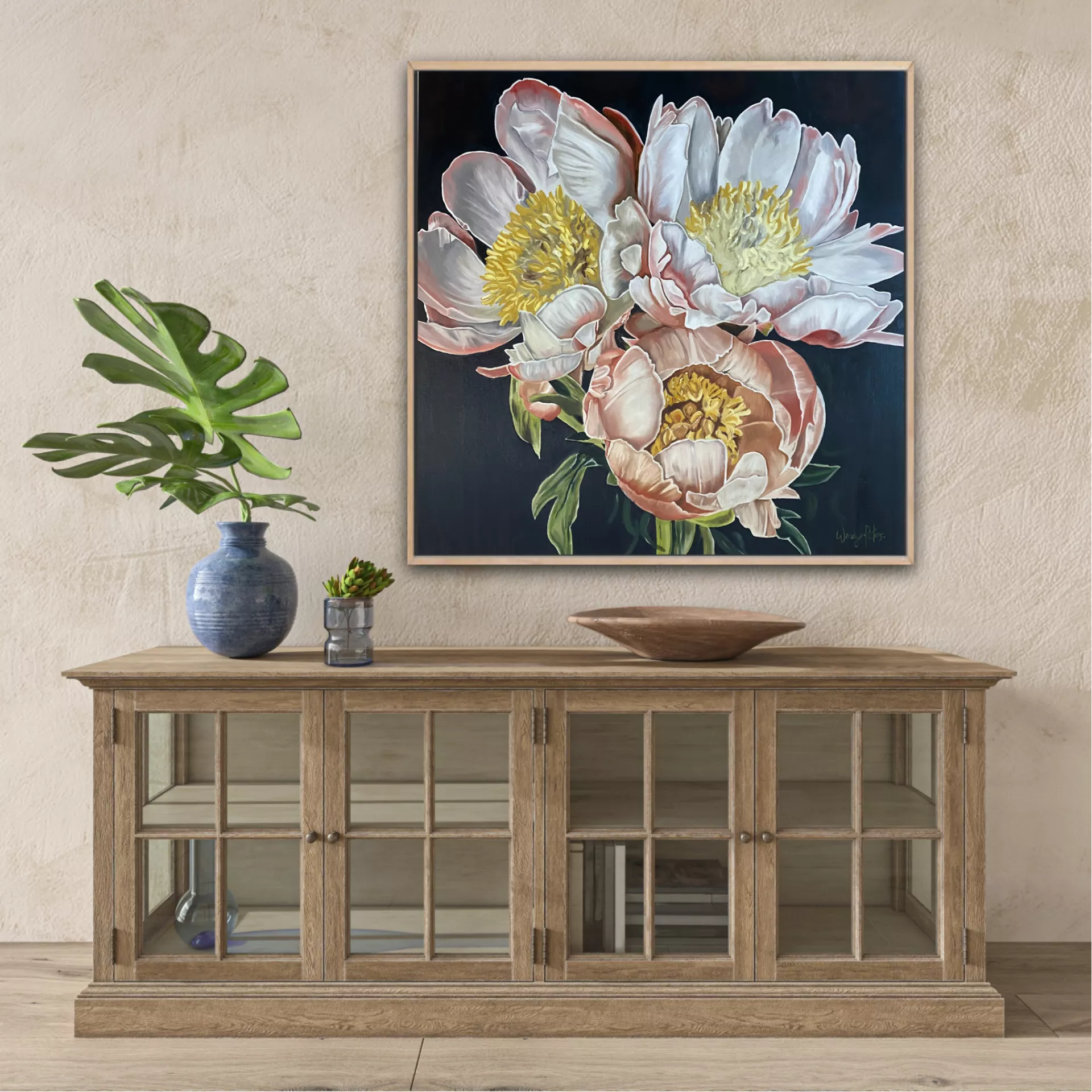 A limited edition print of a 3 peonies on a dark background featuring detailed, colours of pink, white and yellow by Wendy Peters