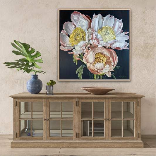 A limited edition print of a 3 peonies on a dark background featuring detailed, colours of pink, white and yellow by Wendy Peters