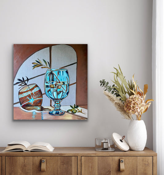 original oil painting of a blue stemmed glass with a single olive branch throwing abstract shadows on a wall with a window in the background by Wendy Peters