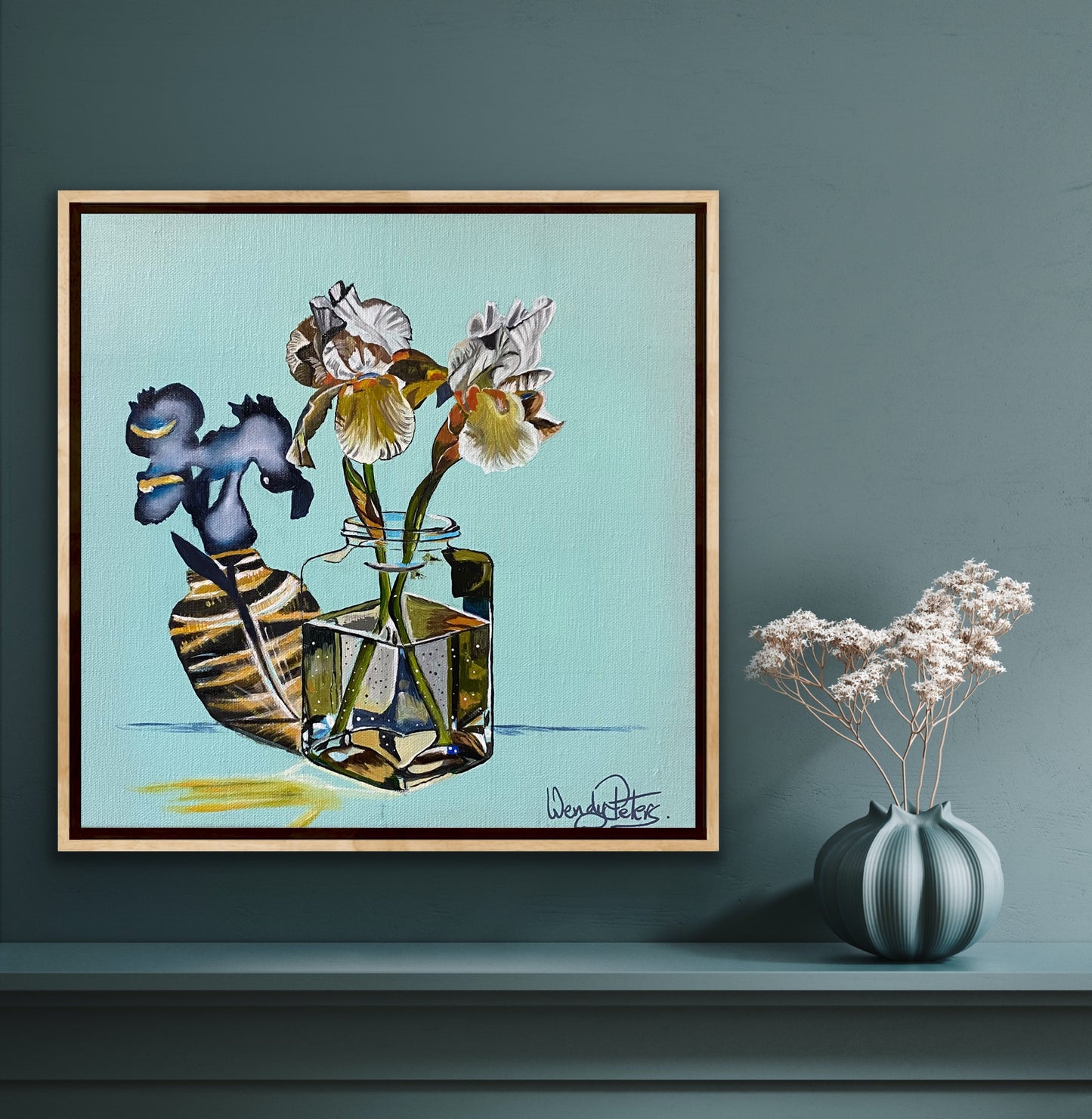 original oil painting of two iris flowers in a glass jar with abstract reflections on a pale blue background by Wendy Peters